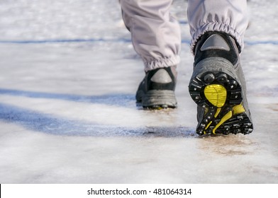 Male Or Female Winter Boots Walking On Snowy Sleet Road