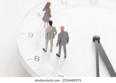 Male figurines standing on the white clock. 
Image of working hours, career, employment, deadline, and appointment. - Powered by Shutterstock