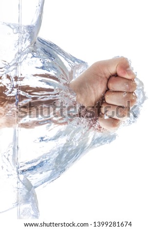 A male fist is smashing the water with waves and bubbles. Isolated on white background.