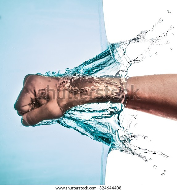 Male Fist Through Blue Water Splashing Stock Photo 324644408 | Shutterstock