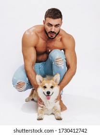 Male Fitness Model With Dog Corgi