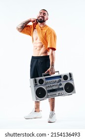Male Fitness Model, Man Showing Muscles. Posing With Old School Radio.