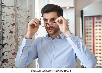 Male Fitting Glasses On His Eye In Optics Store