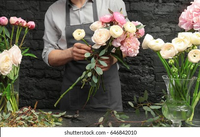 Male florist creating beautiful bouquet in flower shop, close up - Shutterstock ID 646842010