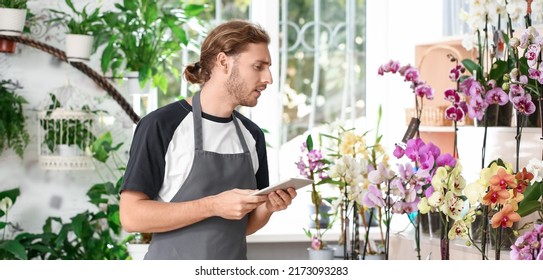 Male Florist With Tablet Computer In Shop