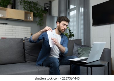 Male Freelancer Teaches Remotely, Uses Laptop, Looks At Webcam, Explains Economic Theory To Students