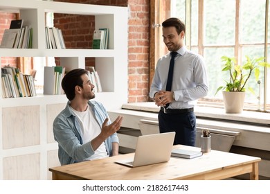 Male Friends Colleagues Office Employees Talk Enjoy Pleasant Conversation Share Business News Gather At Modern Workplace. Good Work Relation, Collaboration, Mentor And Apprentice Communication Concept