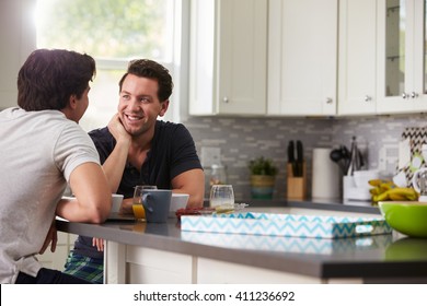 Male Gay Couple In Their 20s Talking In Their Kitchen