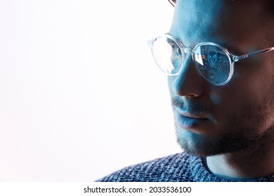 Male In Glasses With Futuristic Holographic Interface To Display Data. Portrait Of Beautiful Young Man. Augmented Reality, Future Technology, Internet Concept.