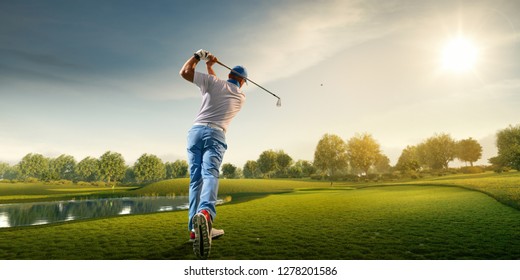 Мужской игрок в гольф на профессиональном поле. Гольфист с гольф-клубом, снимающим выстрел