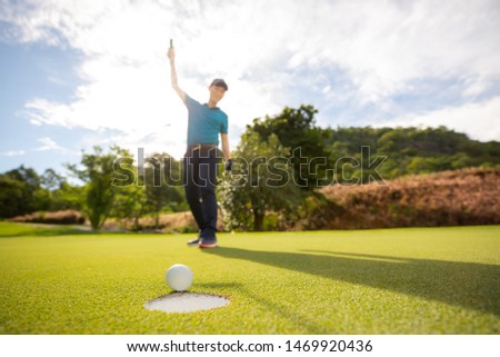 Male golfer is happy with his victory.