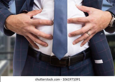 Male Grabbing Bloated Abdomen Belly As Indigestion Constipation Bowel Or Flatulence Problem