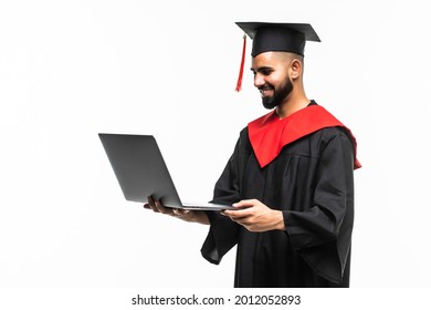 Male Graduate Holding A Laptop Computer And Smiling At The Camera Isolated On White Background