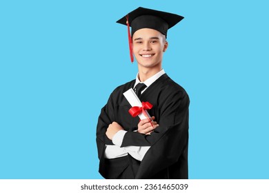 Male graduate student with diploma on blue background - Powered by Shutterstock