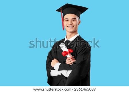 Male graduate student with diploma on blue background