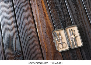 Male Grooming On A Luxury Wooden Background. Travel Nail Trimming Kit With Copy Space.