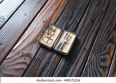 Male Grooming On A Luxury Wooden Background. Travel Nail Trimming Kit With Copy Space.