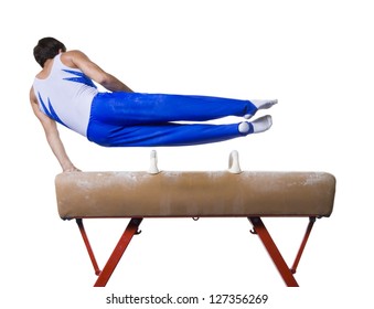 Male gymnast performing on vaulting horse