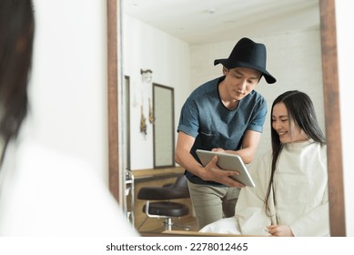 male hairdresser and female clientele - Powered by Shutterstock