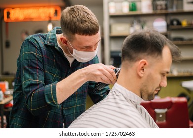 Male Hairdresser Giving A Haircut With Medical Mask