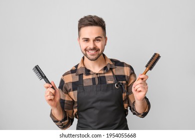 Male Hairdresser On Grey Background