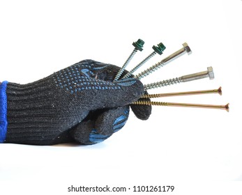 Male hand in black working glove holding the self tapping screws. White background