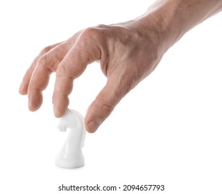 Male Hand With Chess Piece On White Background