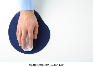 Male Hand With Computer Mouse And Pad On White Background