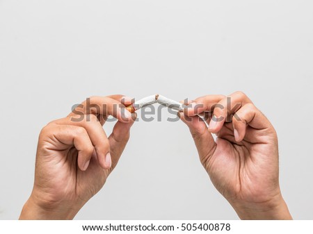 Male hand crushing cigarette, Concept Quitting smoking,World No Tobacco Day