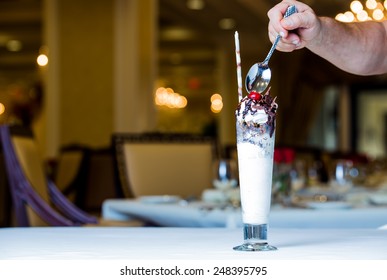 Male Hand Eating Hot Fudge Sundae 