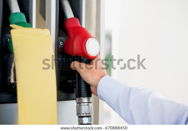 male hand at gas\
pistol