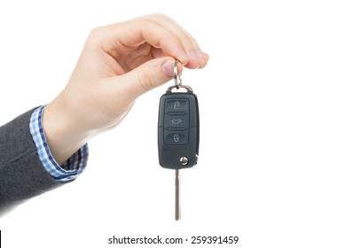 Male Hand Giving Car Keys - Studio Shot Isolated On White Background