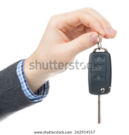 Male hand giving car keys - studio shot isolated on white background