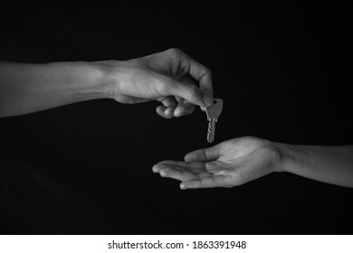 Male Hand Handing The Master Key