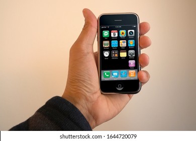 A Male Hand Holding A 1st Generation IPhone With The Main Display Turned On In Landscape Layout. Originally Released June 2007. February 13, 2020. San Francisco, CA.