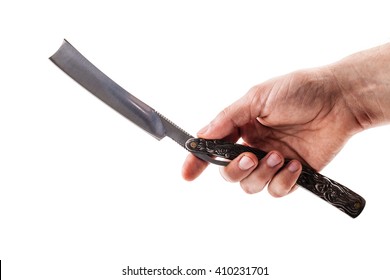 a male hand holding a big cut throat straight razor isolated over a white background