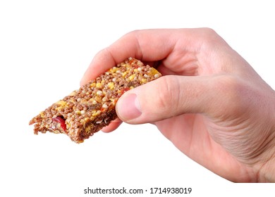 Male Hand Holding Bitten Brown Granola Bar Isolated On White Background