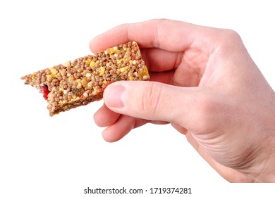 Male Hand Holding Bitten Brown Granola Bar Isolated On White Background