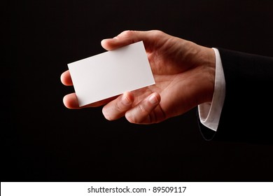 Male Hand Holding Blank Business Card. Add Your Own Design