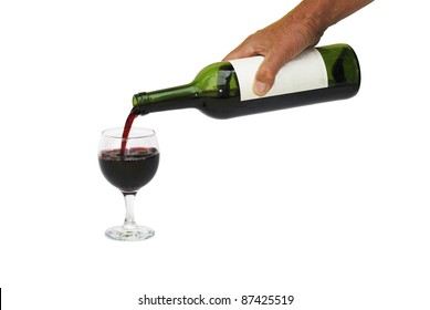 Male Hand Holding Bottle Of Red Wine And Pouring Into A Wineglass