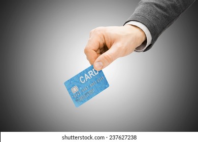 Male Hand Holding Credit Card - Paying Concept