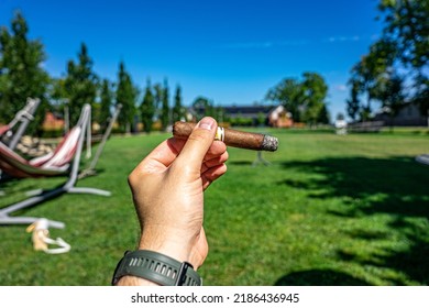 Male Hand Holding A Cuban Cigar