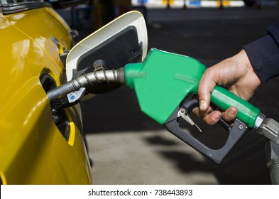 Male Hand Holding Gas Pump One Last Drop Of Fossil Fuel