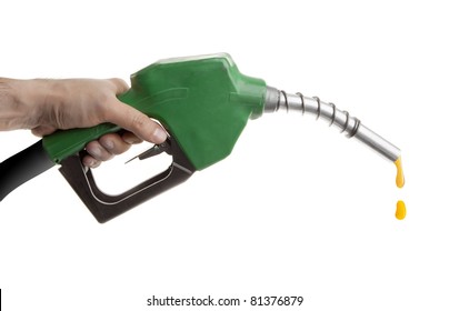 Male Hand Holding Gas Pump Isolated On White With One Last Drop Of Fossil Fuel