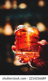 Male Hand Holding A Glass Of Coktail In A Bar