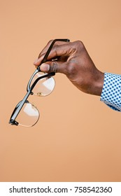 Male Hand Holding Glasses, Isolated