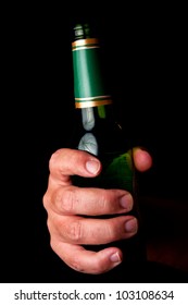 Male Hand Holding Green, Empty Beer Bottle