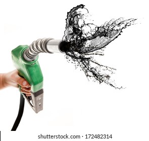 Male Hand Holding Green Gas Pump With Strong Perspective Isolated On White Spilling Petrol