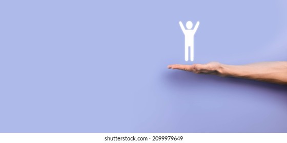 Male Hand Holding Human Icon On Grey Background. Human Resources HR Management Recruitment Employment Headhunting Concept.Select Team Leader Concept. Male Hand Click On Man Icon.Banner ,copy Spase