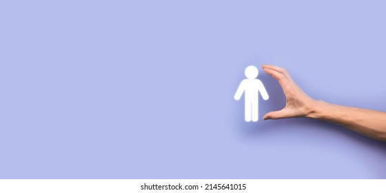 Male Hand Holding Human Icon On Blue Background. Human Resources HR Management Recruitment Employment Headhunting Concept.Select Team Leader Concept. Male Hand Click On Man Icon.Banner ,copy Spase